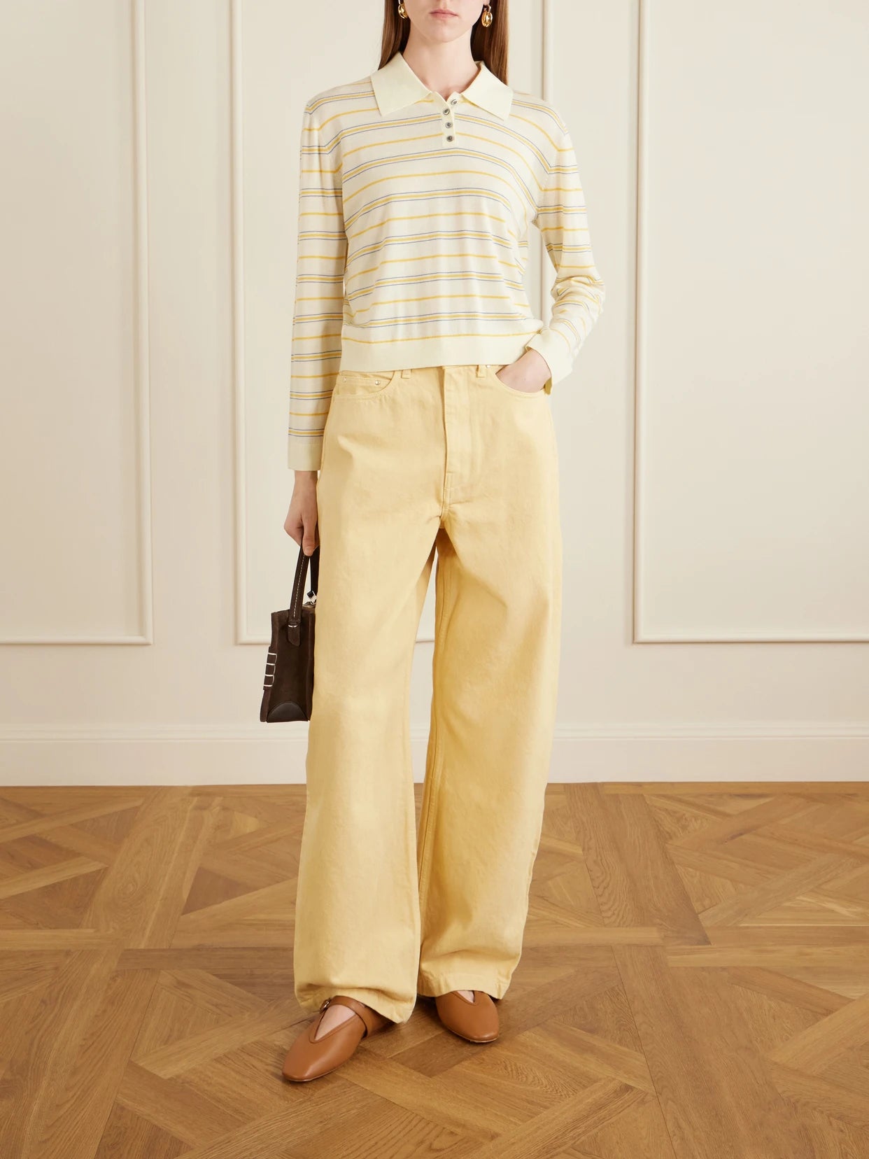 Image of a model wearing Outerwear. Product name - James Striped Merino Wool Polo Shirt in Pastel yellow colour by brand - LESET