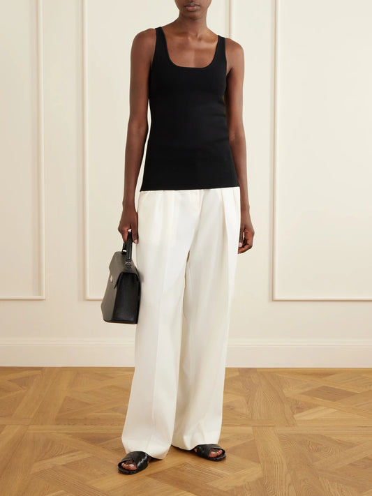 Image of a model wearing Tops. Product name - Classic Tank in Black colour by brand - TOTEME