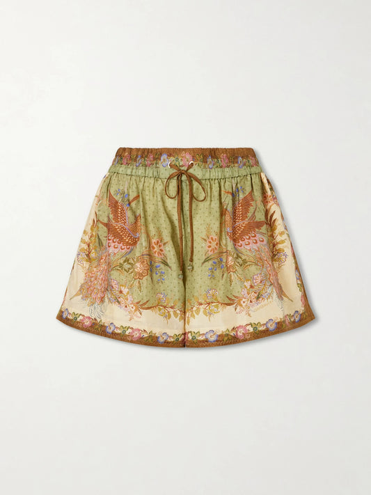 Image of a model wearing Shorts. Product name - Indra Printed Silk-satin Drawstring Shorts in Green colour by brand - Zimmermann