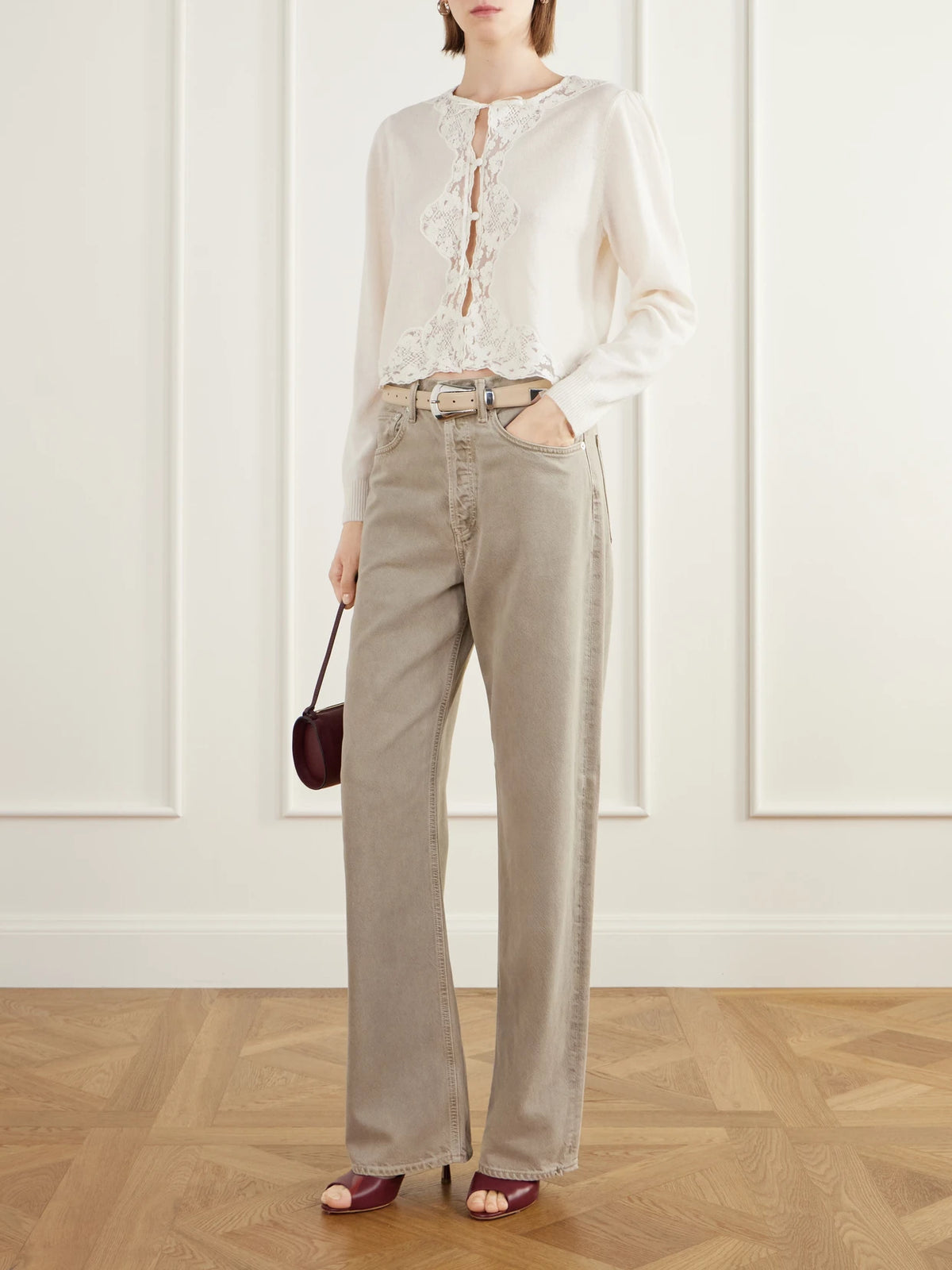 Image of a model wearing Outerwear. Product name - Tassia Bow-detailed Lace-trimmed Wool And Cashmere-blend Cardigan in Ivory colour by brand - RIXO