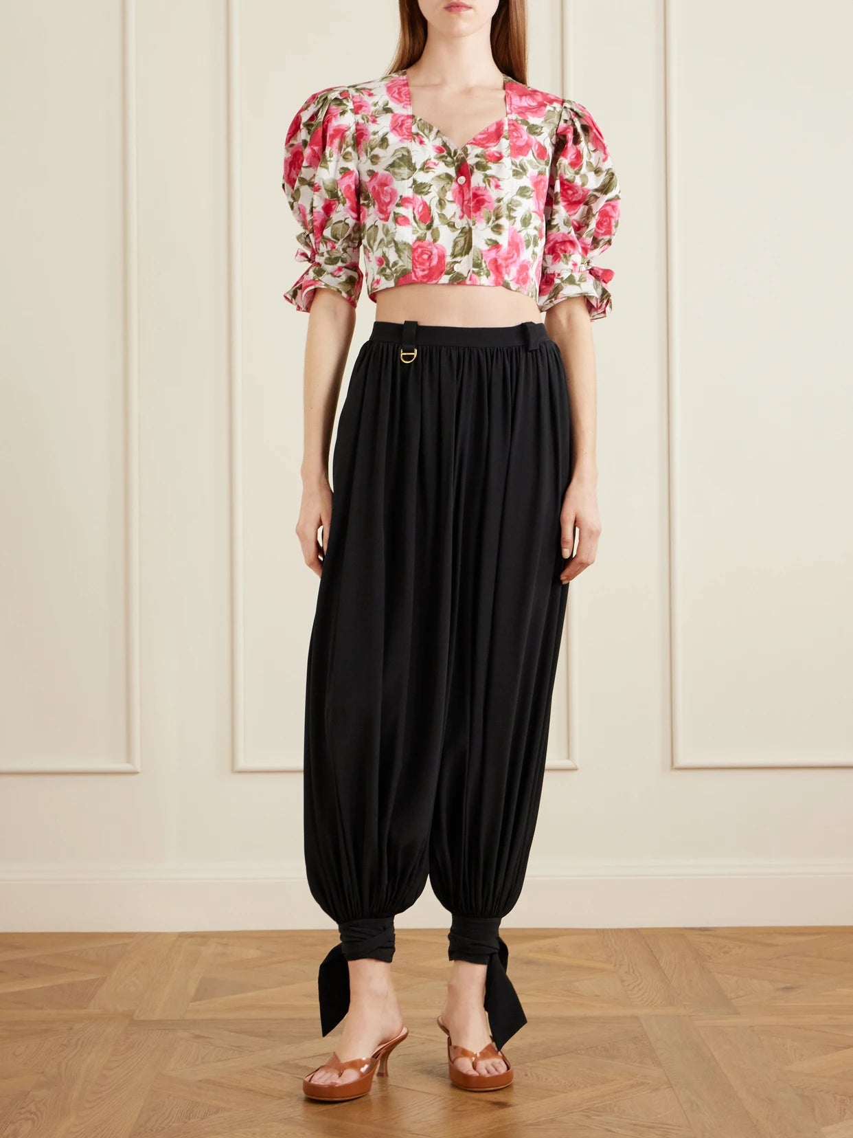 Image of a model wearing Pants. Product name - Silk Crepe De Chine Balloon Pants in Black colour by brand - Chloé