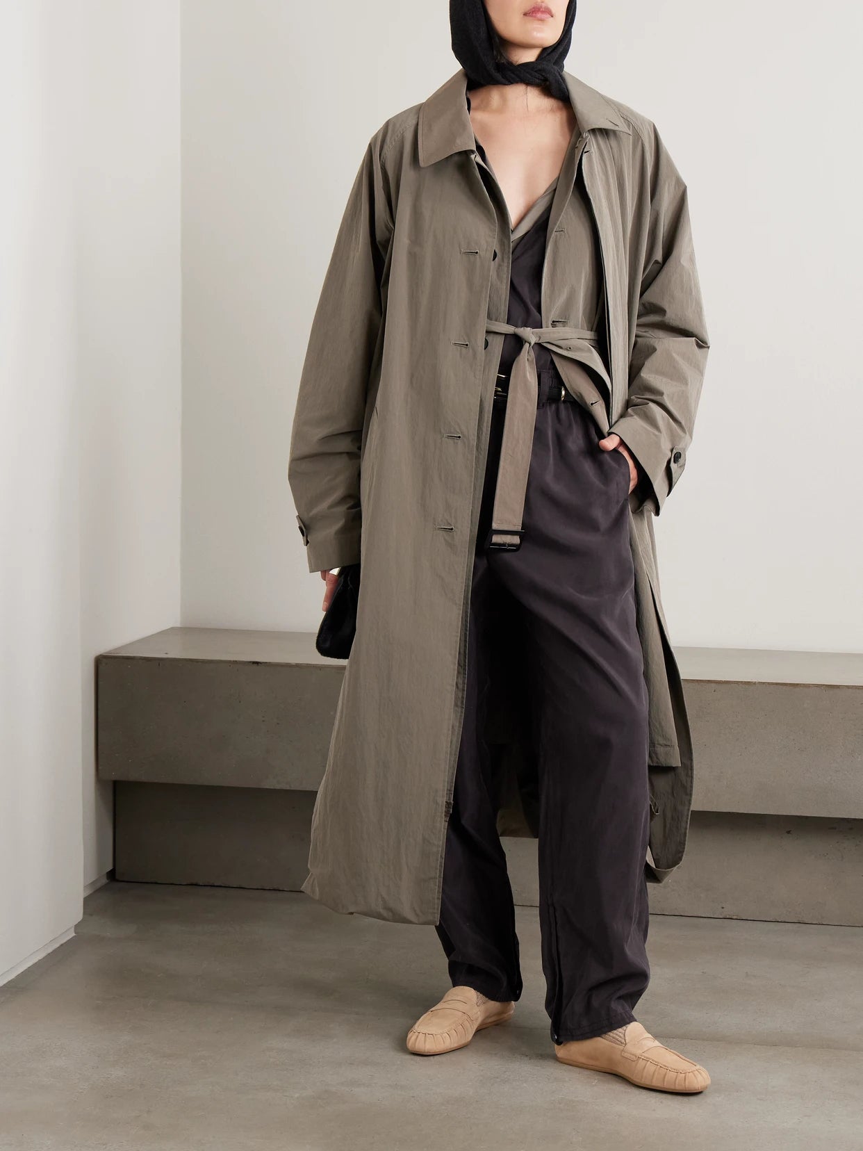 Image of a model wearing Pants. Product name - Pleated Silk-blend Track Pants in Charcoal colour by brand - ssstein