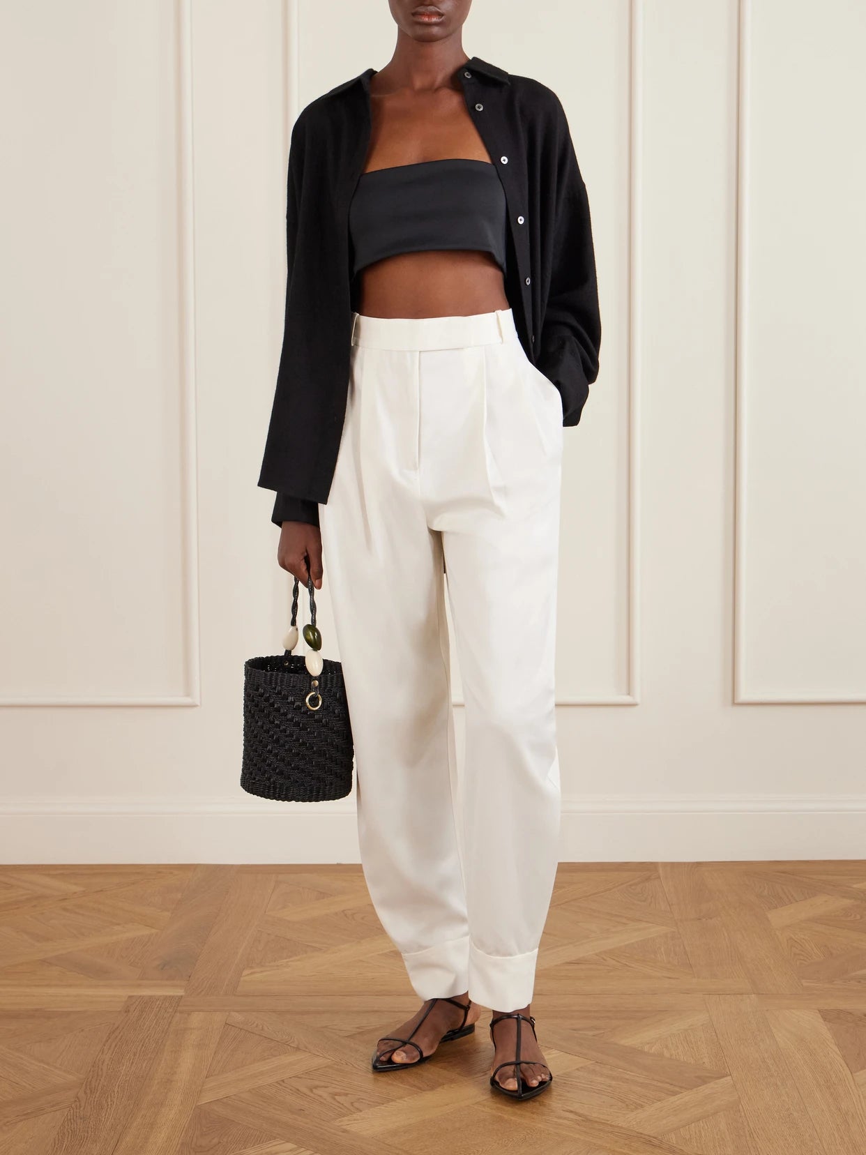 Image of a model wearing Tops. Product name - Zoe Scuba Bralette Top in Black colour by brand - THE PARK