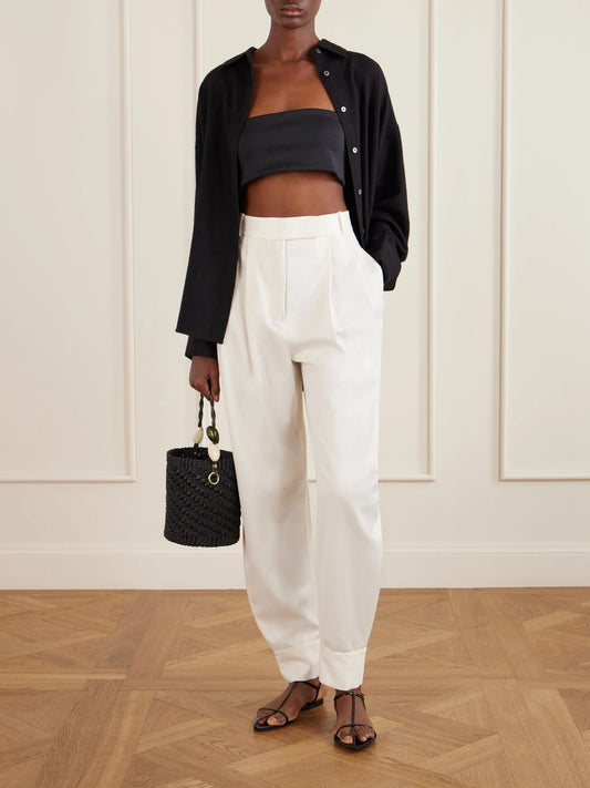 Image of a model wearing Tops. Product name - Zoe Scuba Bralette Top in Black colour by brand - THE PARK