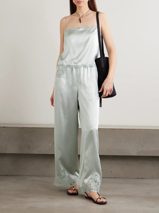 Image of a model wearing Pants. Product name - Lavon Lace-trimmed Silk-satin Wide-leg Pants in Blue colour by brand - DÔEN