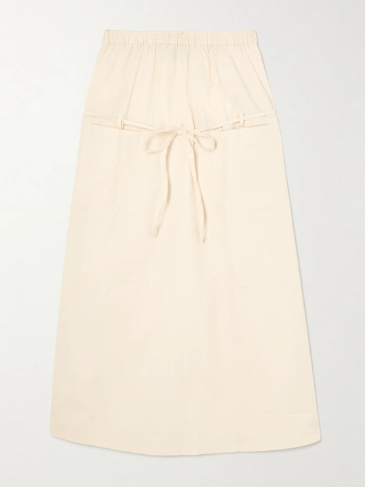 Image of a model wearing Skirts. Product name - Loop Organic Cotton Midi Skirt in Off-white colour by brand - Deiji Studios