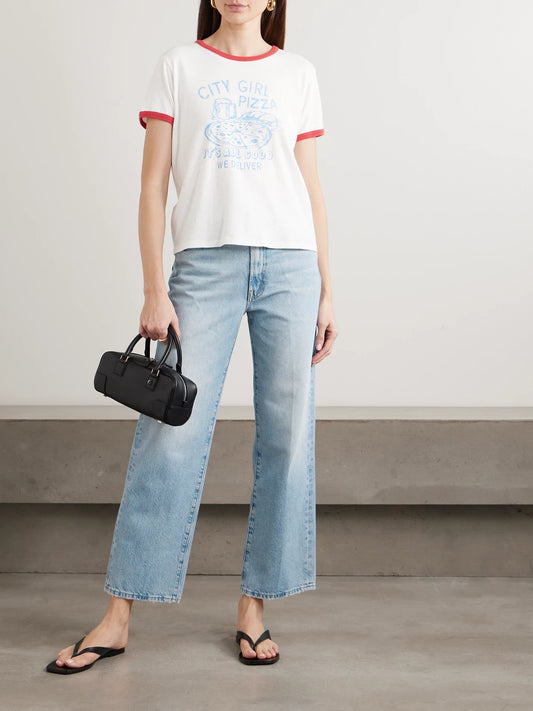 Image of a model wearing Tops. Product name - The Lil Goodie Printed Cotton-blend Jersey T-shirt in White colour by brand - Mother