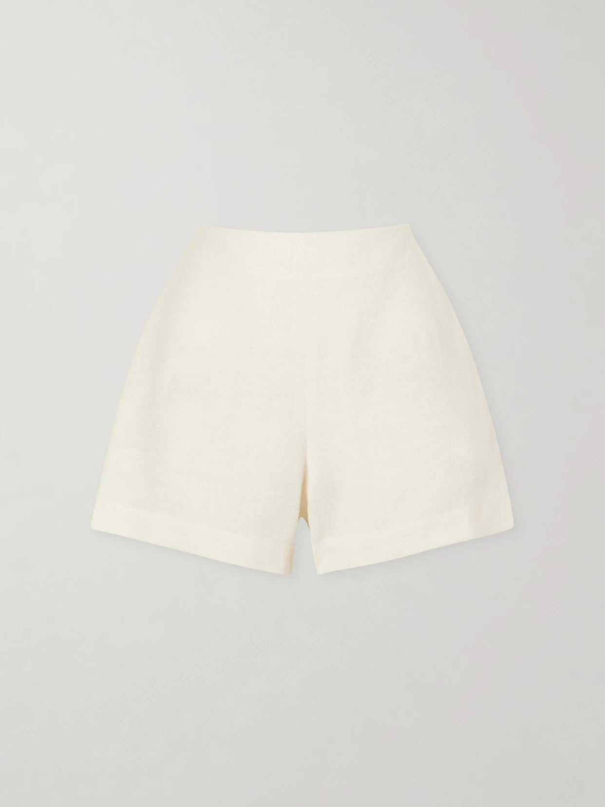 Image of a model wearing Shorts. Product name - Canvas Shorts in White colour by brand - Lisa Marie Fernandez