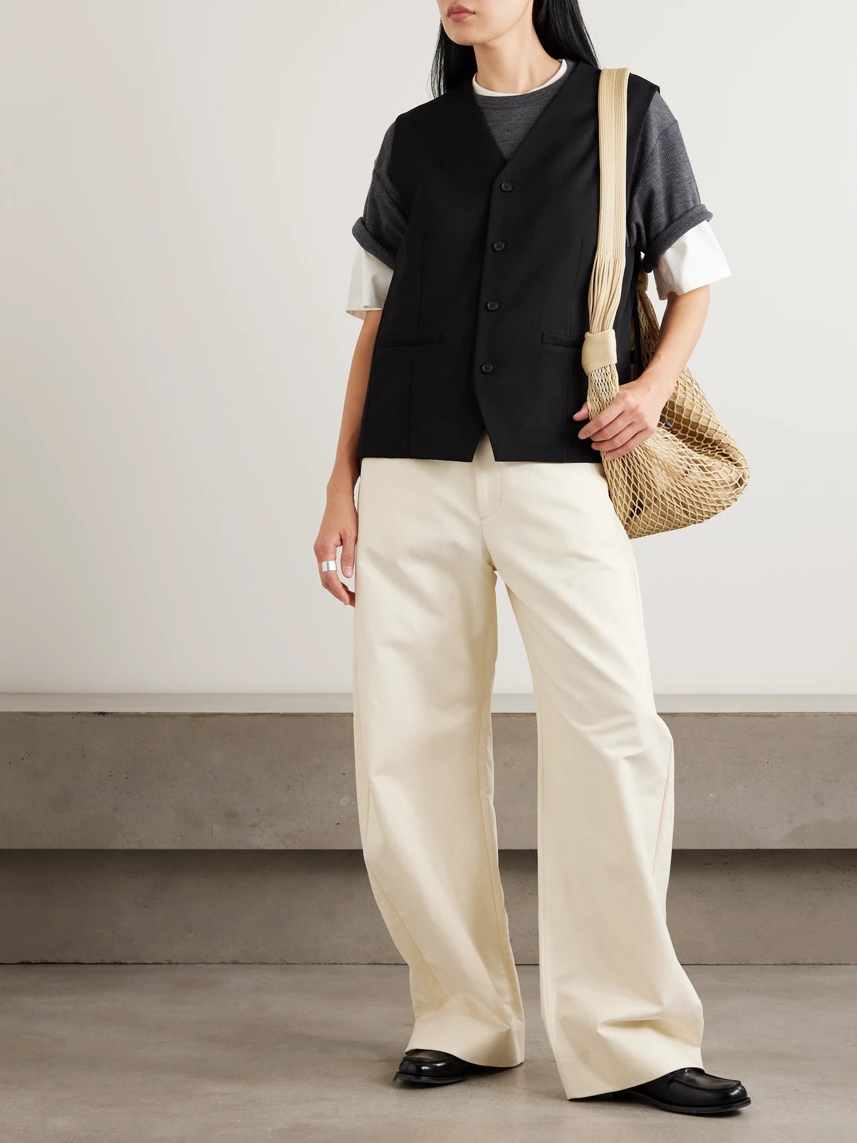 Image of a model wearing Tops. Product name - Ribbed Wool T-shirt in Dark gray colour by brand - ssstein