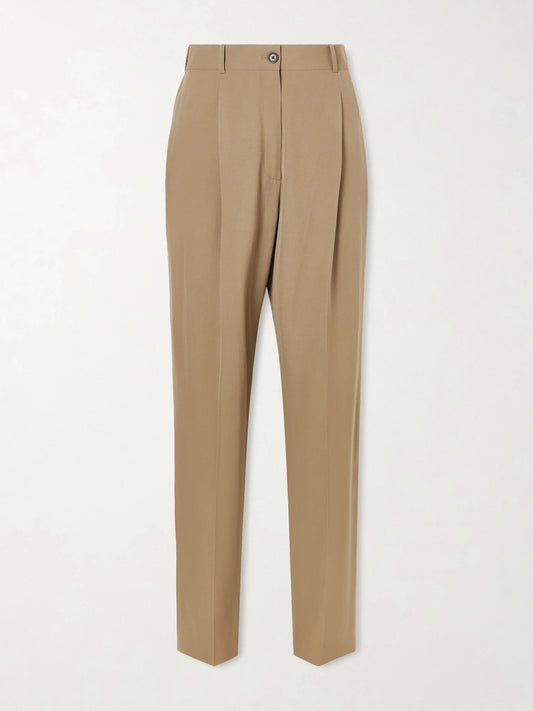 Image of a model wearing Pants. Product name - Gianni Pleated Wool Pants in Beige colour by brand - The Row