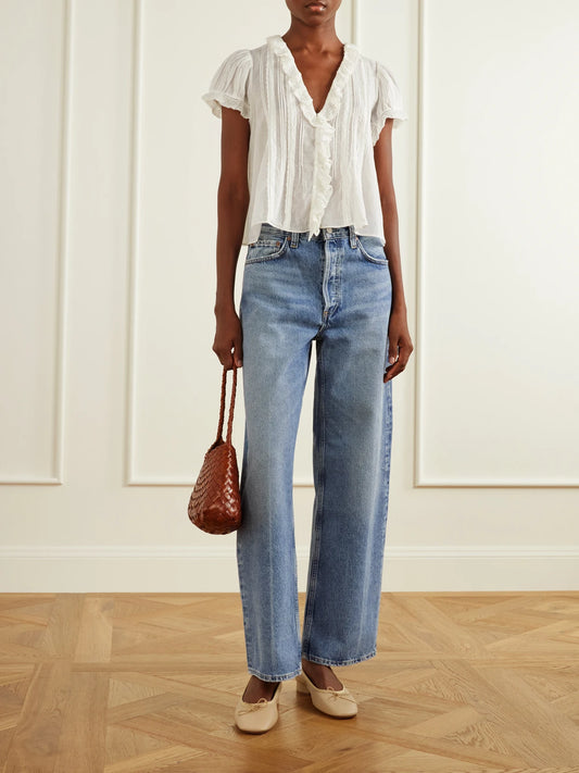 Image of a model wearing Tops. Product name - Helena Lace-trimmed Organic Cotton Blouse in White colour by brand - DÔEN