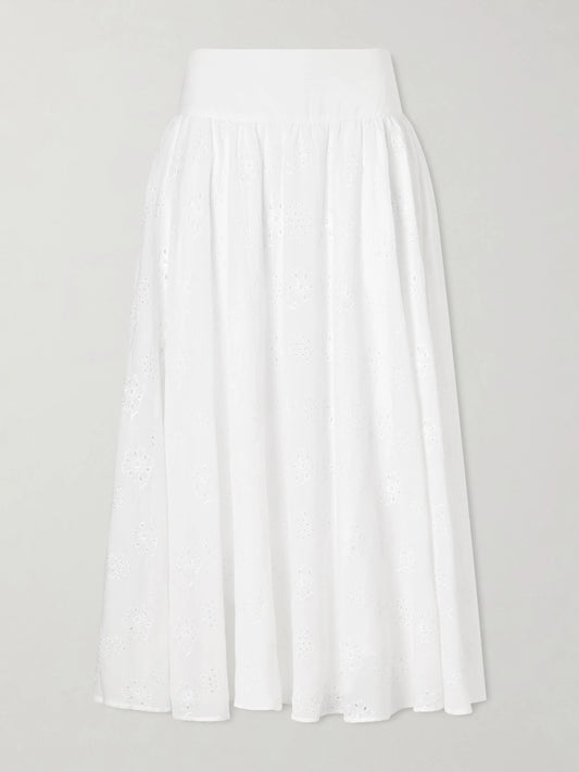 Image of a model wearing Skirts. Product name - Pamela Pleated Broderie Anglaise Cotton Midi Skirt in Off-white colour by brand - Thierry Colson