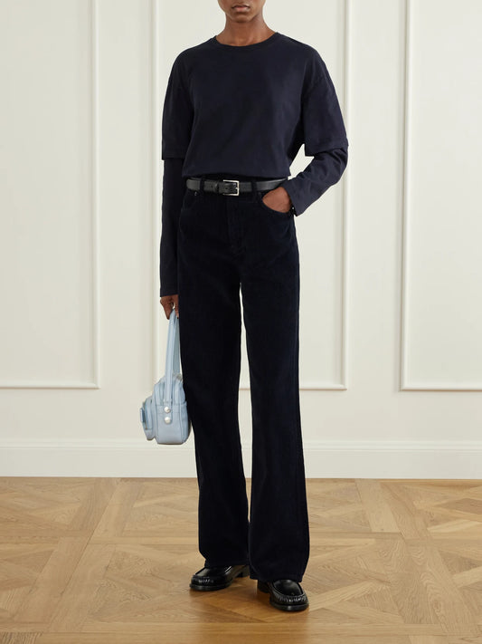 Image of a model wearing Tops. Product name - Lois Layered Organic Cotton-jersey T-shirt in Navy colour by brand - AGOLDE