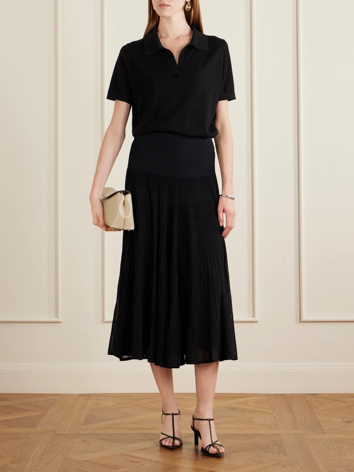 Image of a model wearing Skirts. Product name - Celia Ribbed-knit Midi Skirt in Black colour by brand - Ralph Lauren Collection