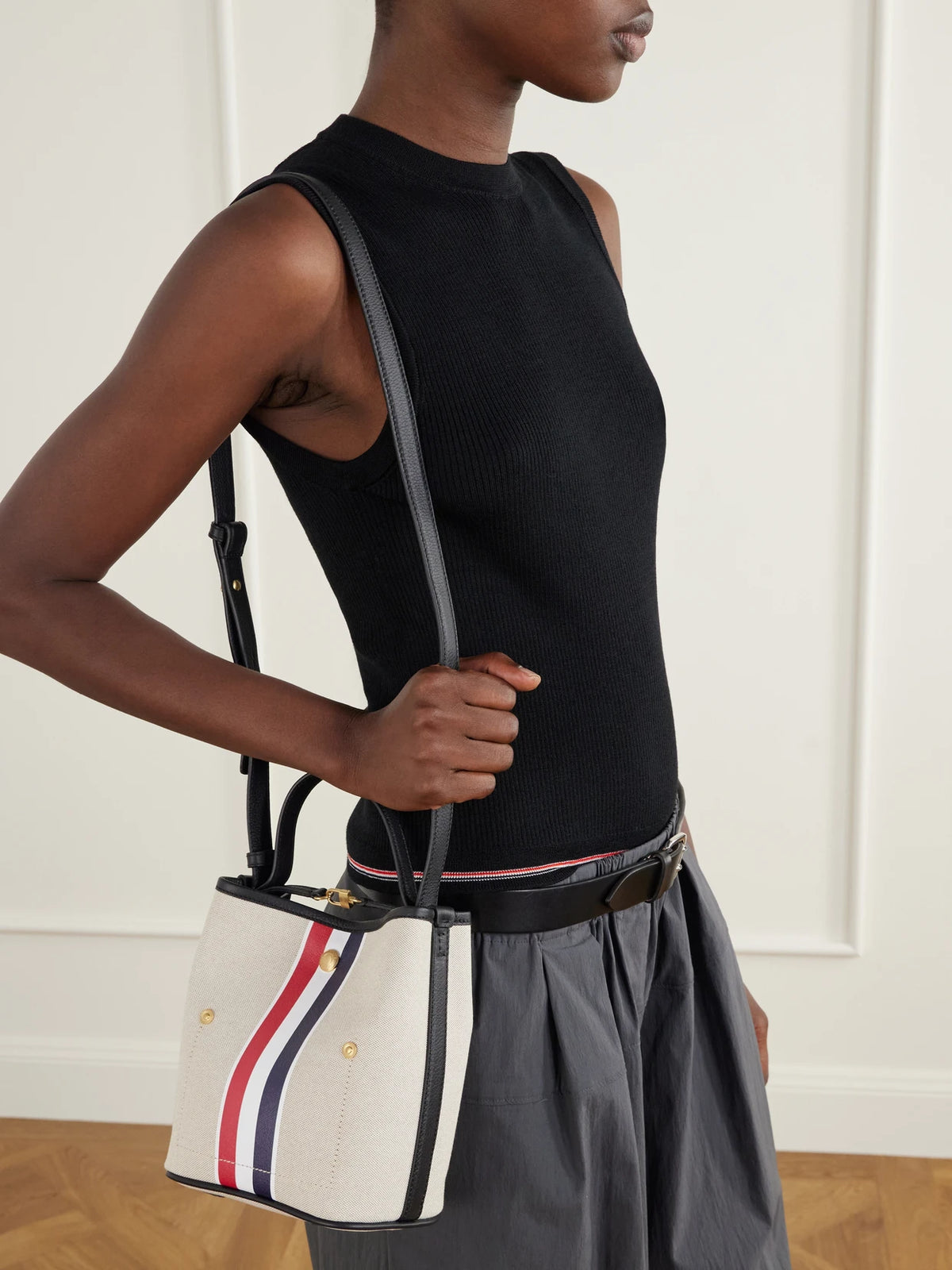 Image of Bags. Product name - Striped Leather-trimmed Canvas Bucket Bag in Ivory colour by brand - Thom Browne