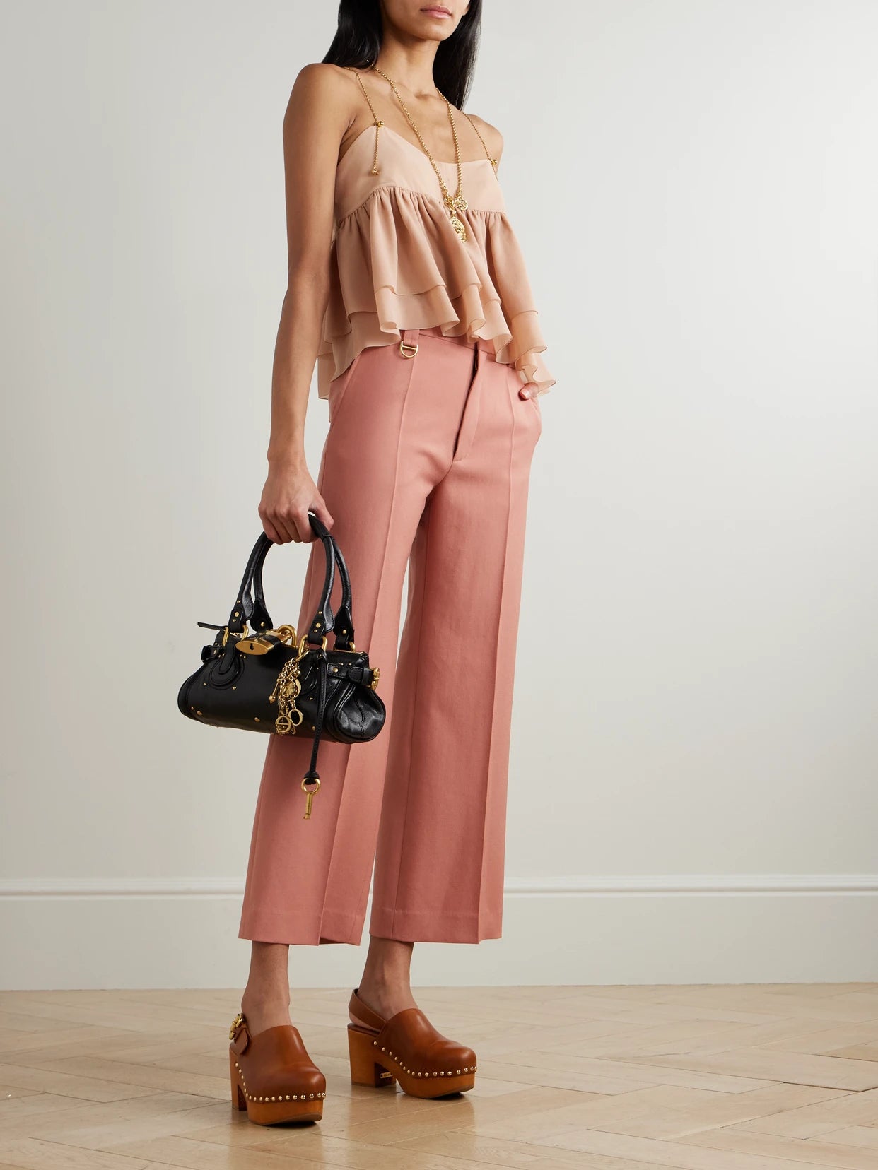 Image of a model wearing Pants. Product name - Cropped Wool-gabardine Wide-leg Pants in Pink colour by brand - Chloé