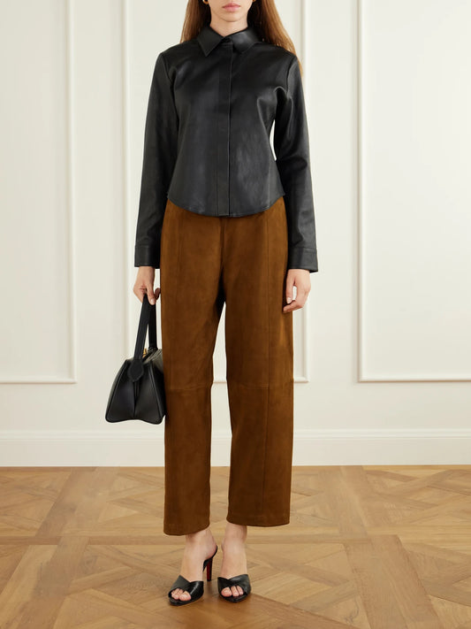 Image of a model wearing Pants. Product name - Bugsy Wide-leg Suede Pants in Brown colour by brand - STOULS