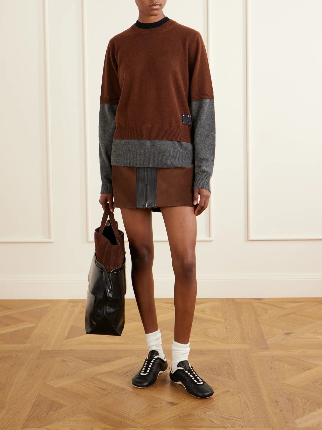 Image of a model wearing Skirts. Product name - Leather-trimmed Suede Mini Skirt in Brown colour by brand - Marni