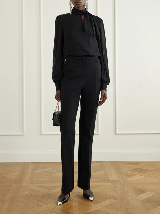 Image of a model wearing Tops. Product name - Bow-detailed Silk-georgette Blouse in Black colour by brand - Valentino Garavani