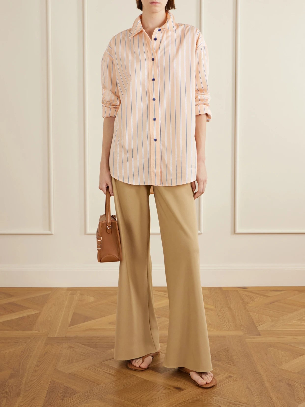 Image of a model wearing Pants. Product name - Colby Recycled Stretch-crepe Wide-leg Pants in Beige colour by brand - La Ligne
