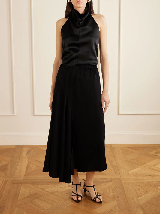 Image of a model wearing Skirts. Product name - Tria Asymmetric Duchess-satin Midi Skirt in Black colour by brand - Sharon Wauchob