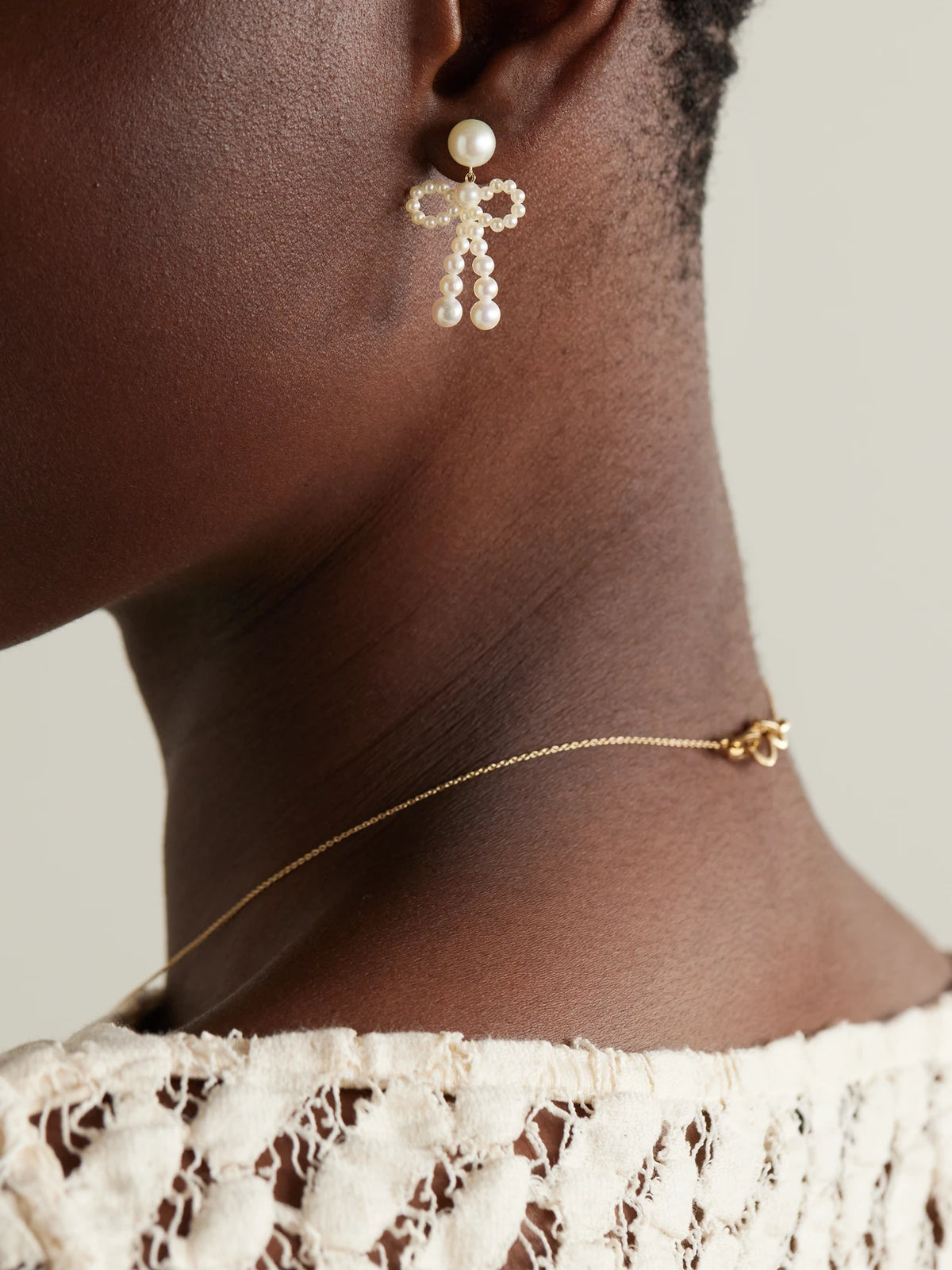 Image of Earrings. Product name - Bow 14-karat Recycled Gold Pearl Earrings in Multi colour by brand - Sophie Bille Brahe