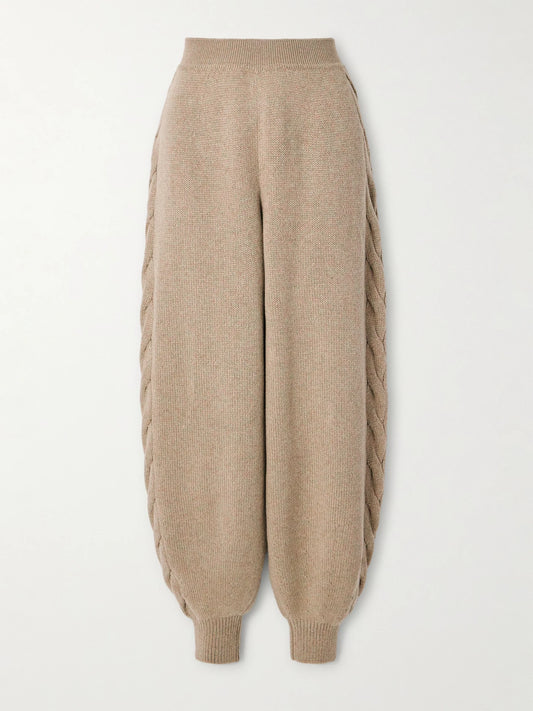 Image of a model wearing Pants. Product name - Cashmere Tapered Pants in Beige colour by brand - Loro Piana