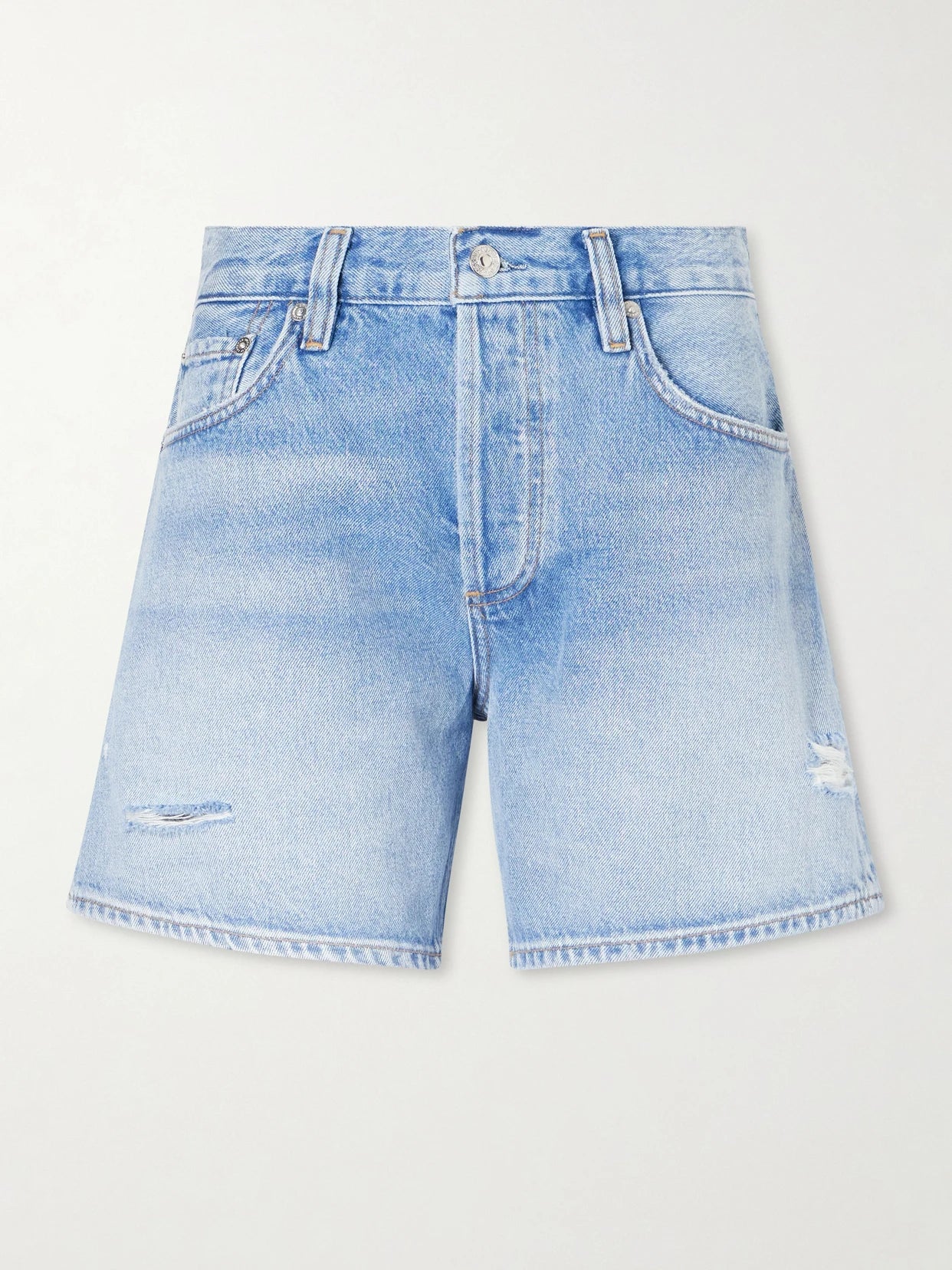 Image of a model wearing Shorts. Product name - Billie Distressed Organic Denim Shorts in Light denim colour by brand - Citizens of Humanity