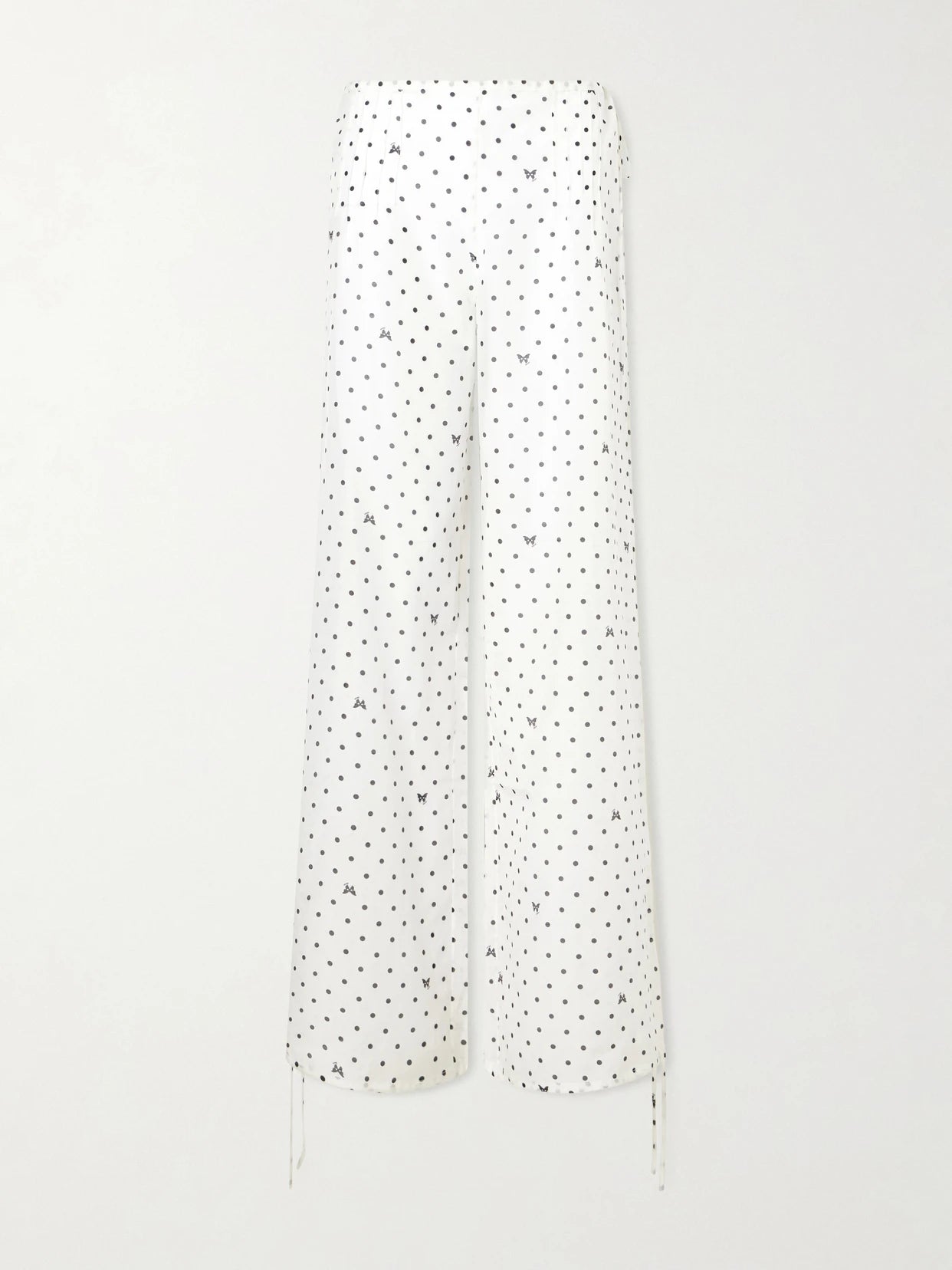 Image of a model wearing Pants. Product name - Kiki Polka-dot Cotton And Silk-blend Balloon Pants in White colour by brand - Kiki de Montparnasse