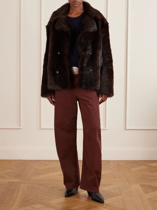 Image of a model wearing Pants. Product name - Tribeca Cotton-blend Twill Tapered Pants in Burgundy colour by brand - Nili Lotan