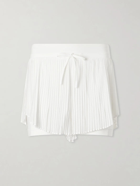 Image of a model wearing Shorts. Product name - Pleated Mesh Tennis Shorts - 2" in White colour by brand - lululemon