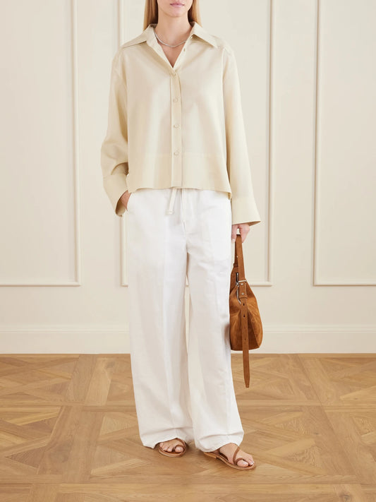 Image of a model wearing Pants. Product name - Aurora Cotton And Linen-blend Wide-leg Pants in White colour by brand - Citizens of Humanity