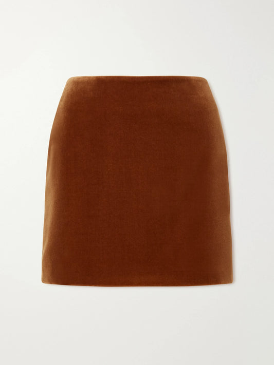 Image of a model wearing Skirts. Product name - Jealousy Cotton-velvet Mini Skirt in Brown colour by brand - BLAZÉ Milano