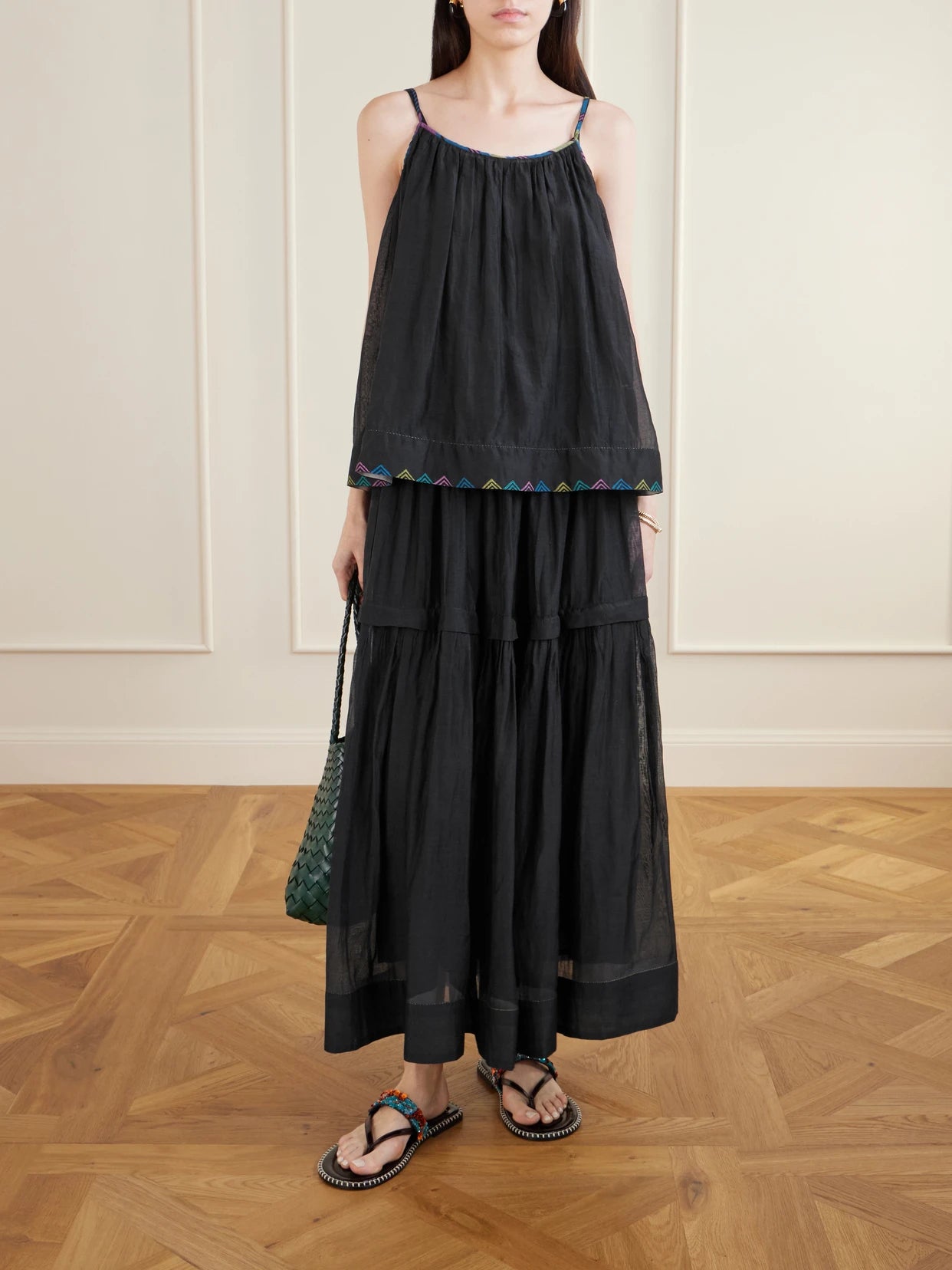 Image of a model wearing Tops. Product name - Gladioli Printed Cotton And Silk-blend Top in Black colour by brand - Eka
