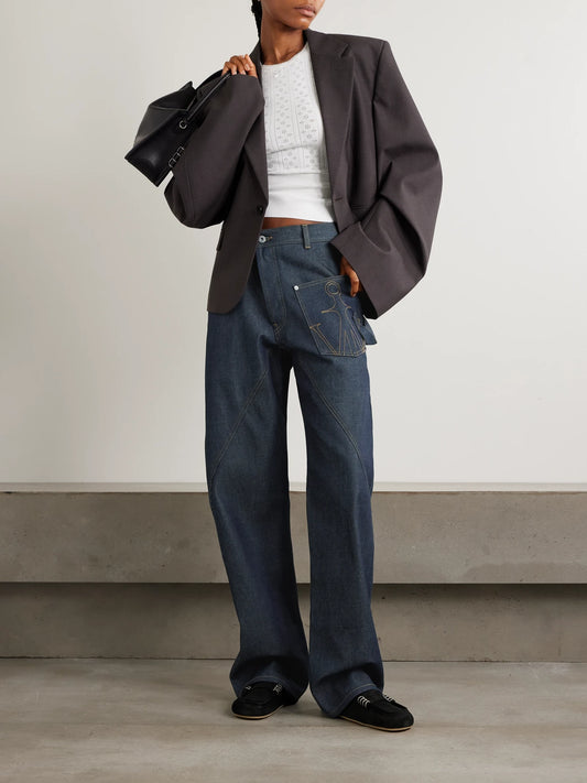 Image of Jeans. Product name - Twisted Asymmetric Embroidered High-rise Jeans in Indigo colour by brand - JW Anderson