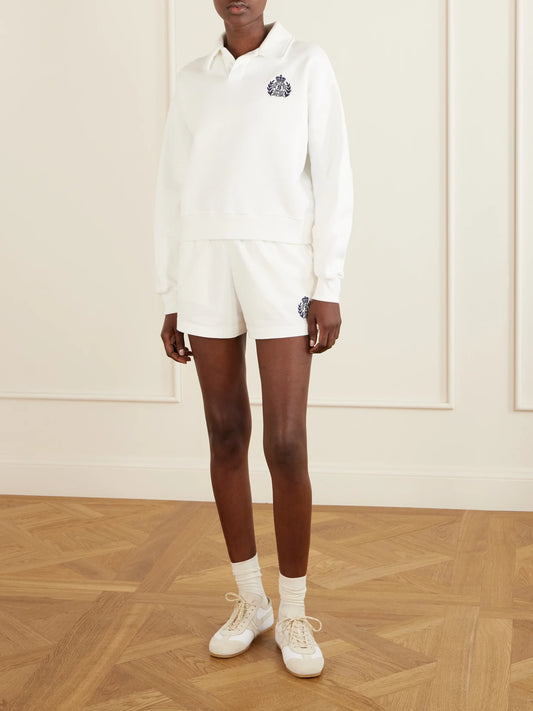 Image of Sleepwear & Loungewear. Product name - Logo-embroidered Cotton Shorts in White colour by brand - Sporty & Rich