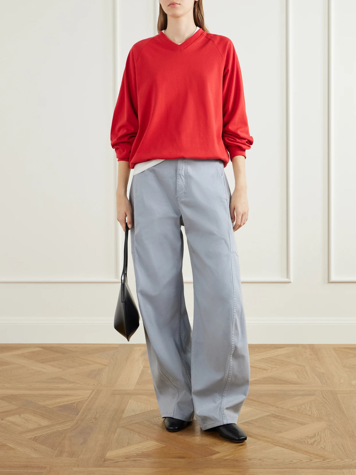 Image of a model wearing Pants. Product name - Sid Lyocell-blend Twill Wide-leg Pants in Blue colour by brand - Tibi