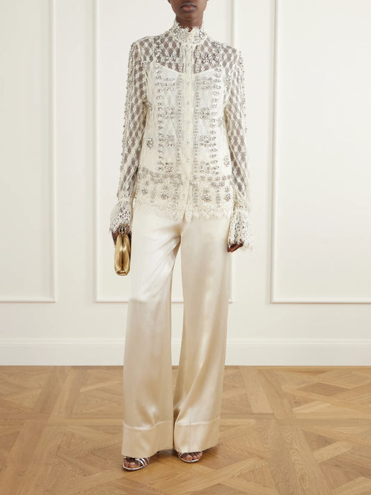 Image of a model wearing Tops. Product name - Lilou Embellished Lace Shirt in Cream colour by brand - Costarellos