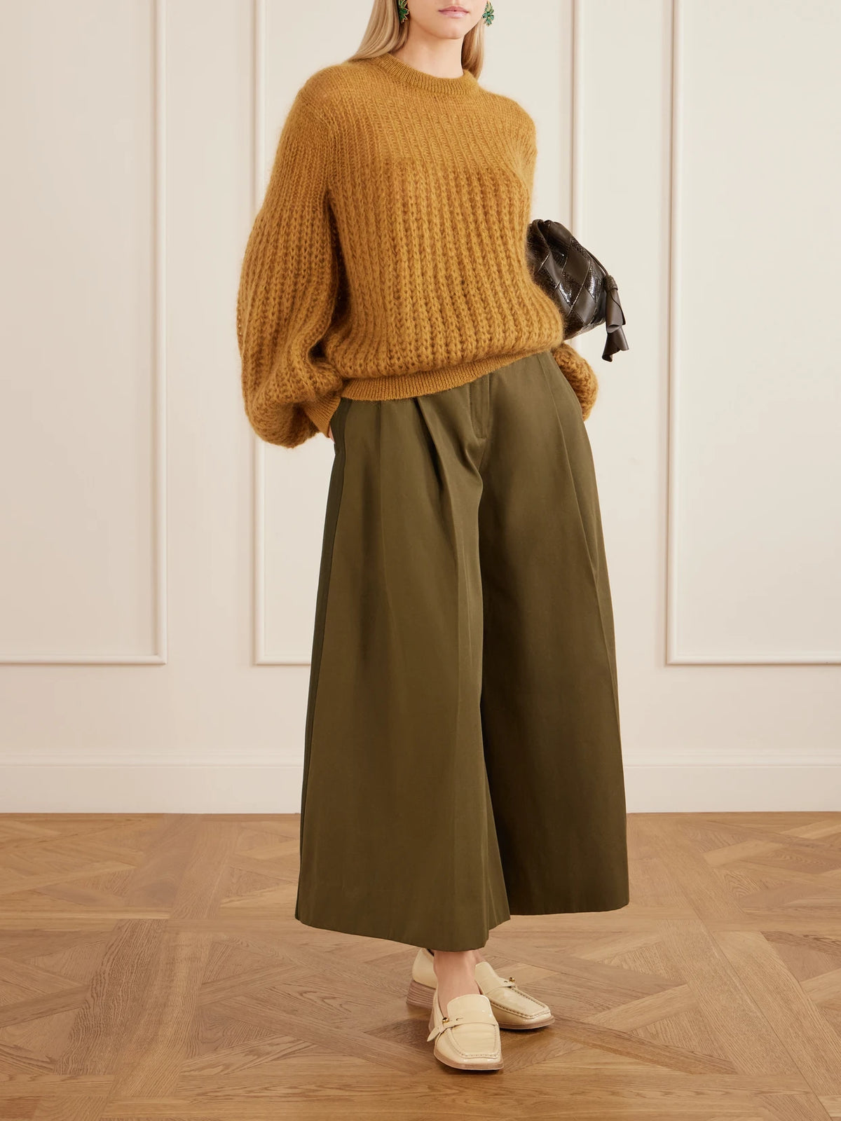 Image of a model wearing Pants. Product name - Valiant Pleated Cotton-twill Wide-leg Pants in Green colour by brand - Zimmermann