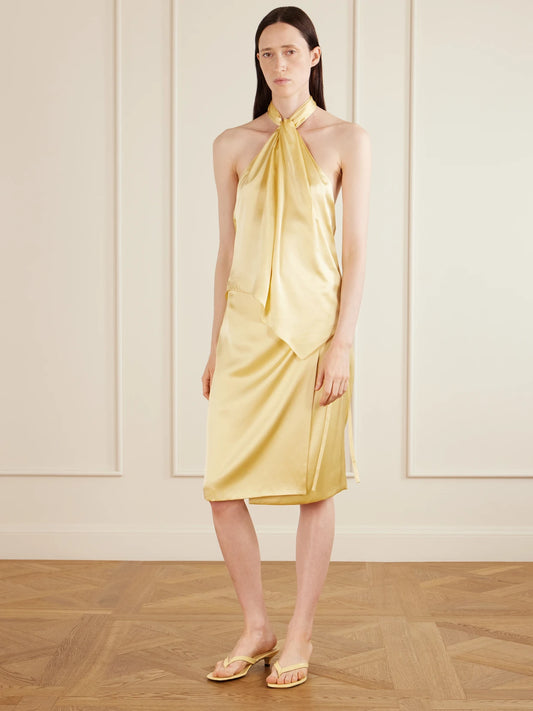 Image of a model wearing Skirts. Product name - Rixa Satin Wrap Midi Skirt in Cream, Red colour by brand - AFLALO