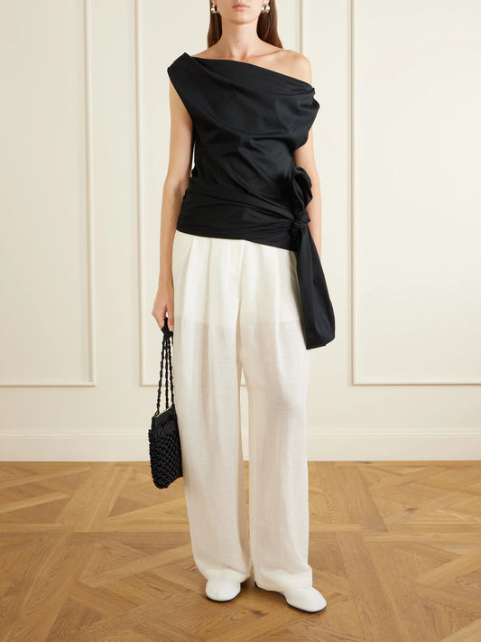Image of a model wearing Tops. Product name - Zafira Bow-detail Cotton-jersey Blouse in Black colour by brand - Proenza Schouler