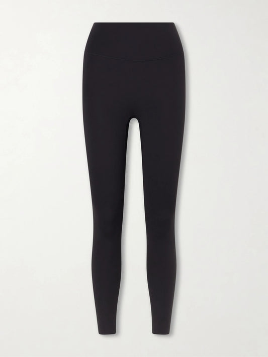 Image of a model wearing Pants. Product name - Zenvy Infinasoft Leggings in Black colour by brand - Nike
