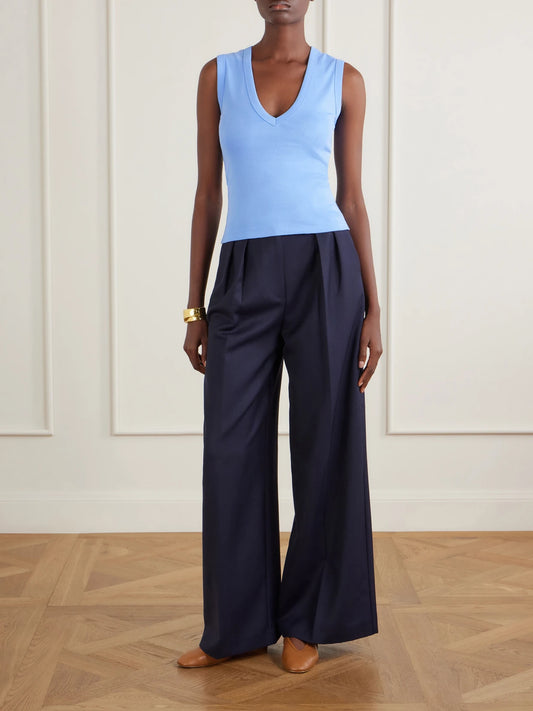 Image of a model wearing Tops. Product name - Dewi Organic Cotton Jersey Tank in Blue colour by brand - FLORE FLORE