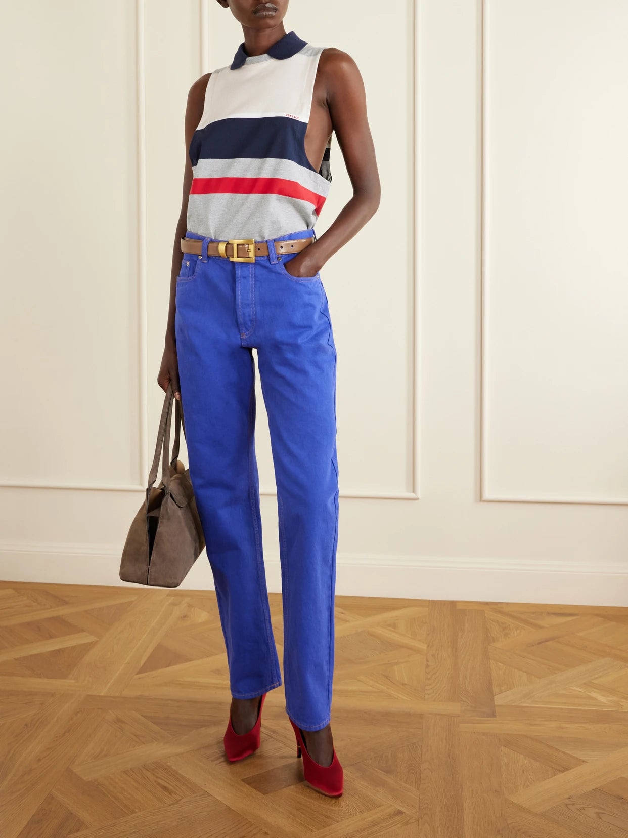 Image of a model wearing Tops. Product name - Sleeveless Embroidered Striped Cotton T-shirt in Gray colour by brand - Versace