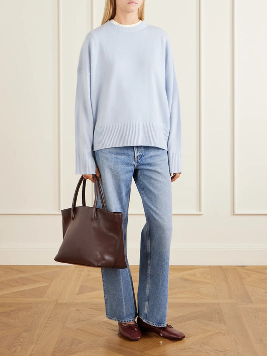 Image of a model wearing Outerwear. Product name - Anton Cashmere Sweater in Light blue colour by brand - Loulou de Saison