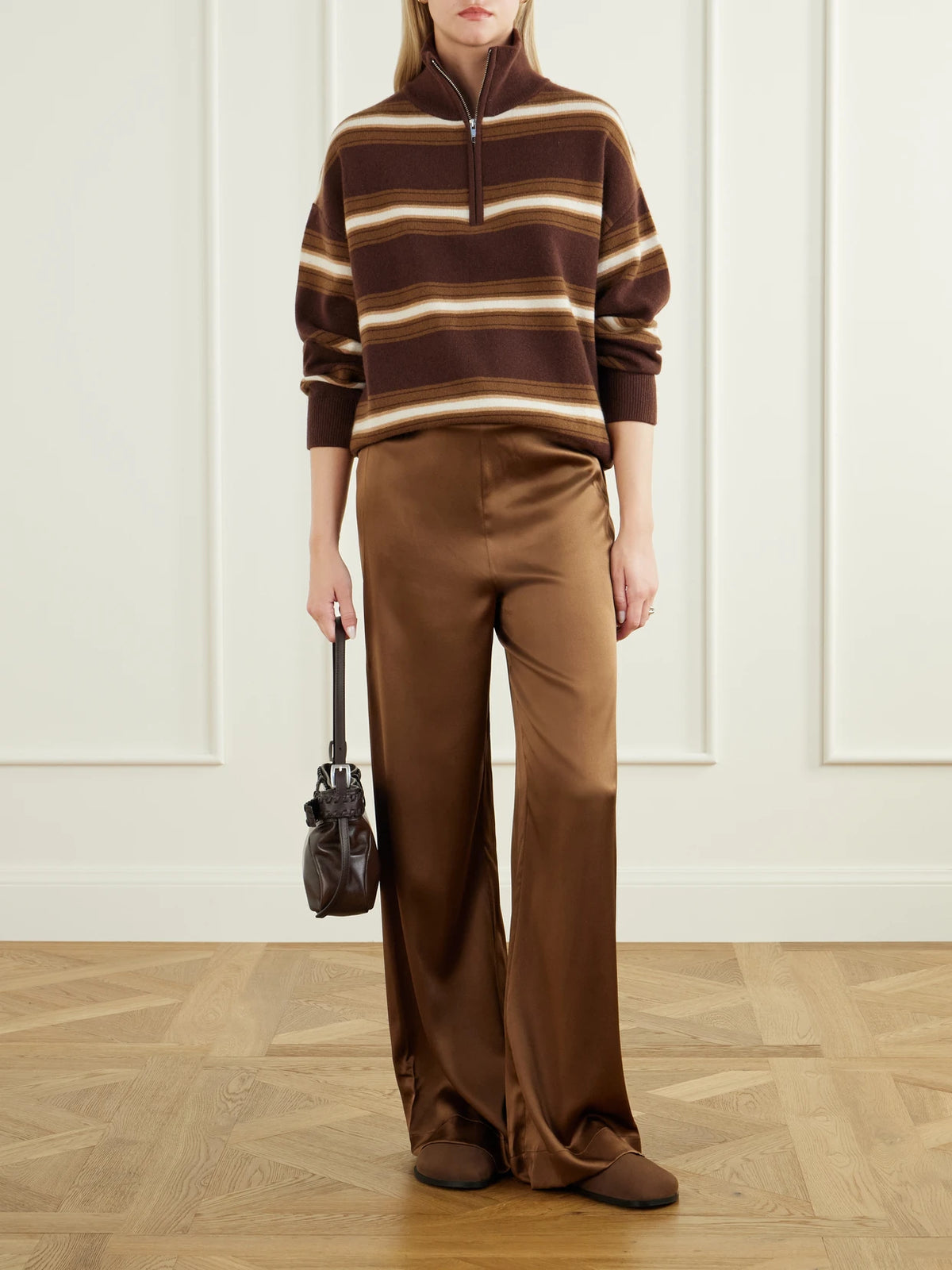 Image of a model wearing Pants. Product name - Stroll Silk-blend Wide-leg Pants in Brown colour by brand - STAUD
