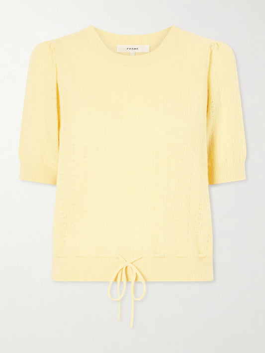 Image of a model wearing Outerwear. Product name - Charm Knitted Cashmere Sweater in Yellow colour by brand - FRAME
