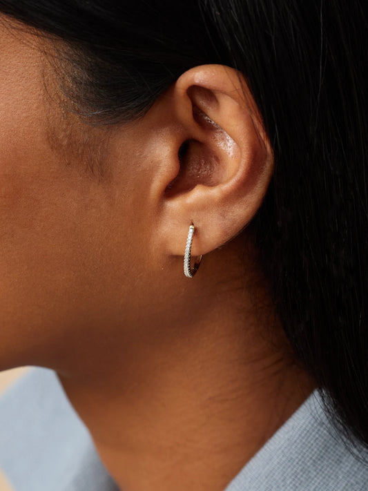 Image of Earrings. Product name - Medium Oval 14-karat Gold Diamond Hoop Earrings in Multi colour by brand - STONE AND STRAND