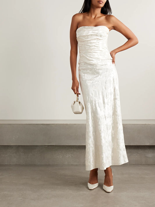 Image of a model wearing Tops. Product name - Demi Strapless Draped Painted Silk And Wool-blend Satin Bustier Top in Off-white colour by brand - Danielle Frankel