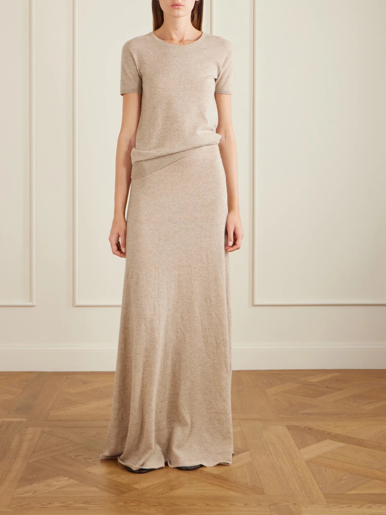 Image of a model wearing Outerwear. Product name - Nova Cashmere T-shirt in Beige colour by brand - The Row